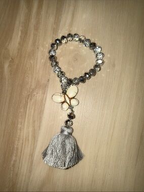 Crystal Bead Bracelet with Ivory Butterfly and Silver Tassel Charm